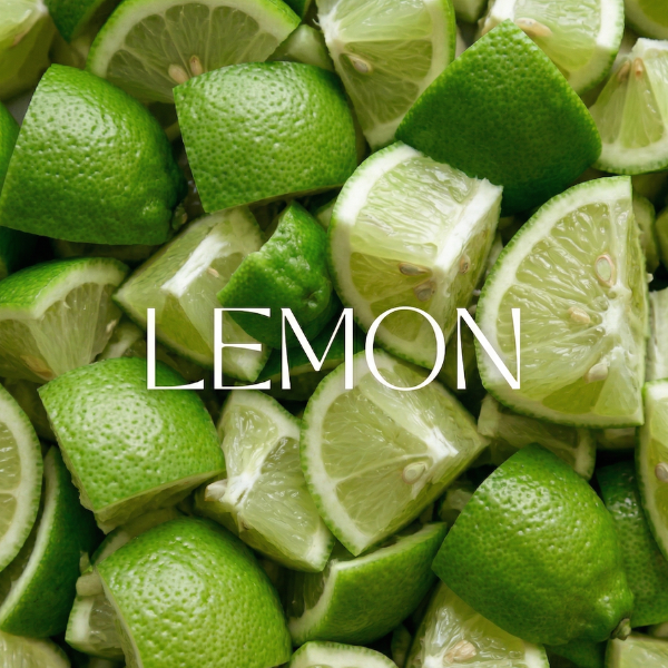 Pile of sliced green lemons with the word 'LEMON' displayed.