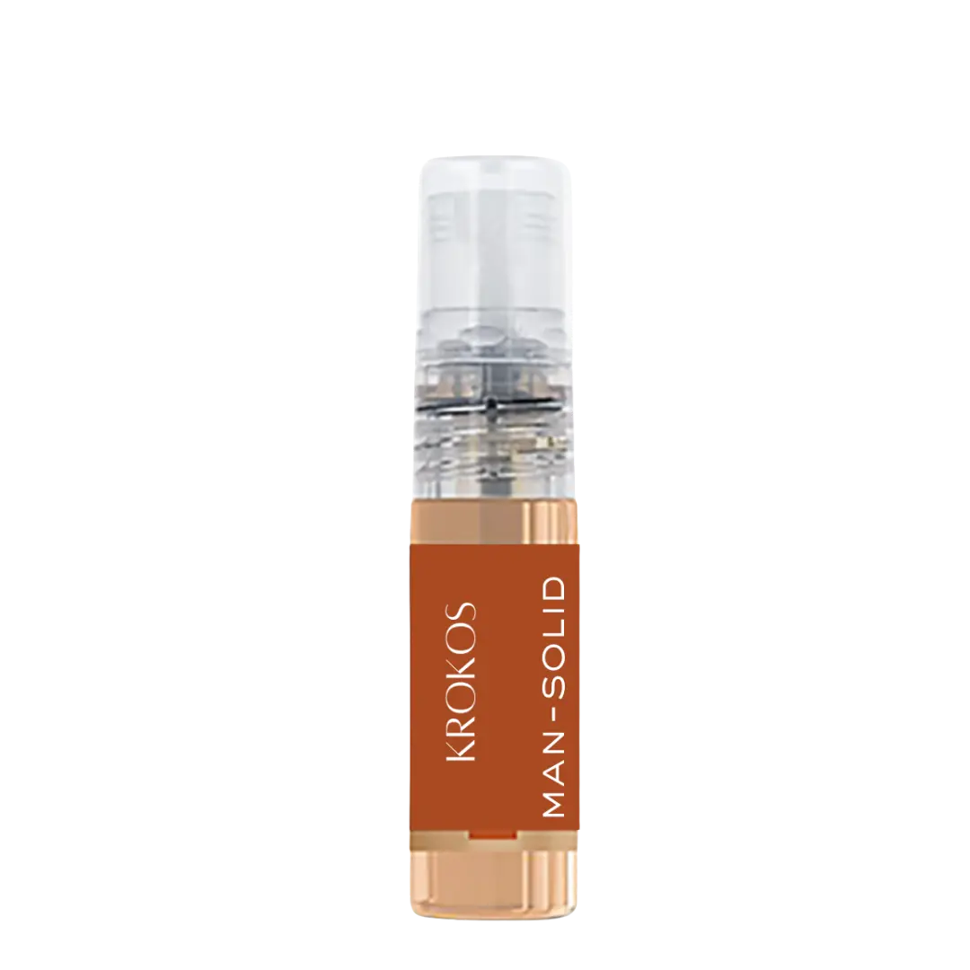 Minimalist cylindrical perfume tester bottle with transparent body, black label, and clear cap on a white background